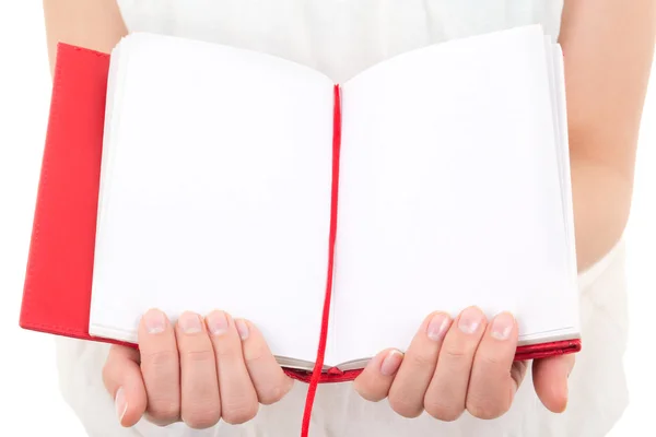 Manos de mujer sosteniendo cuaderno en blanco aislado en blanco — Foto de Stock