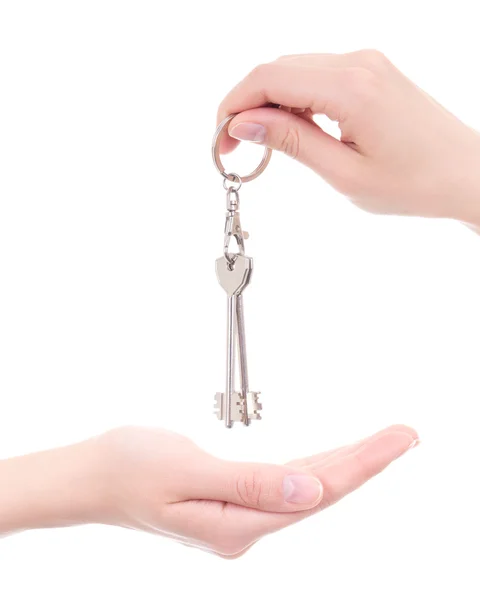 Empty female palm and hand holding key isolated on white — Stock Photo, Image