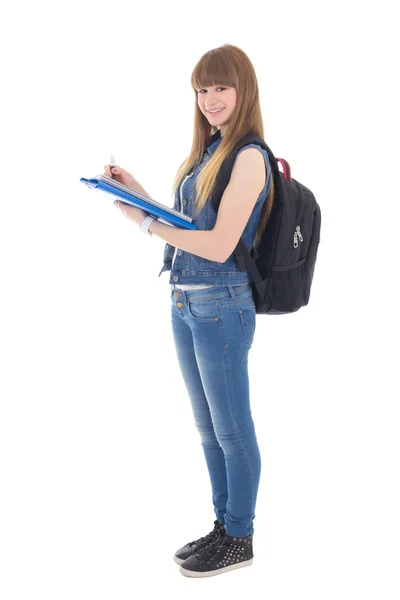 Teenage girl writing in notebook isolated on white — Stock Photo, Image