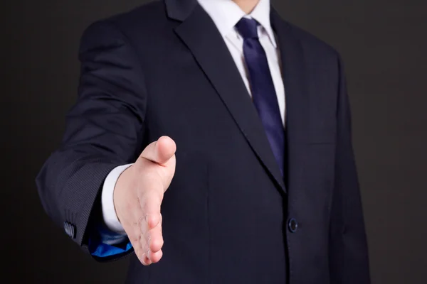 Business man with open hand ready to handshake — Stock Photo, Image