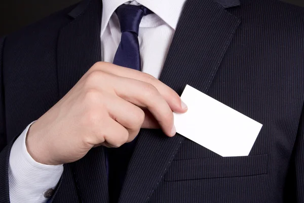 Close up of businessman holding visiting card out of his suit po — Stock Photo, Image