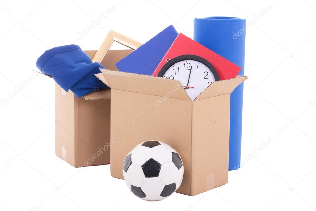 moving day concept - cardboard boxes with stuff isolated on whit
