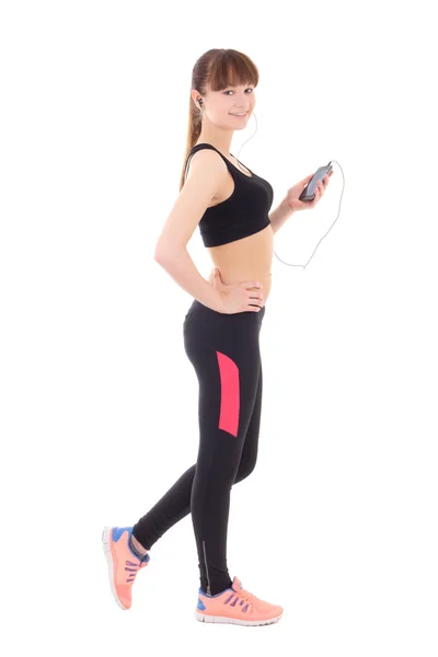 Beautiful slim sporty woman listening music with phone isolated — Stockfoto