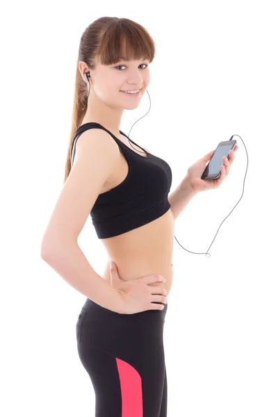 Mooie sportieve vrouw luisteren muziek met telefoon geïsoleerd op wh — Stockfoto