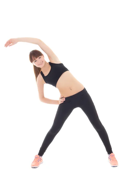 Young sporty woman stretching isolated on white — Stock Photo, Image