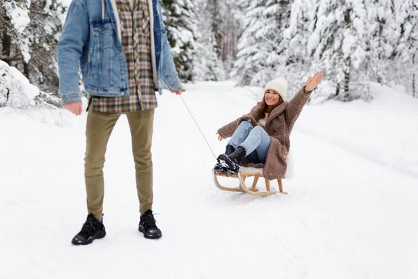 Young Man Pulling Sledge His Joyful Girlfriend Winter Day Forest — Stock Photo, Image