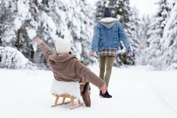 Back View Man Pulling Sledge Joyful Woman Winter Forest — Stock Photo, Image