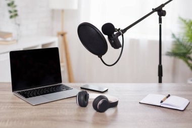 journalism, podcast and blogging concept - setup for recording podcast in home studio