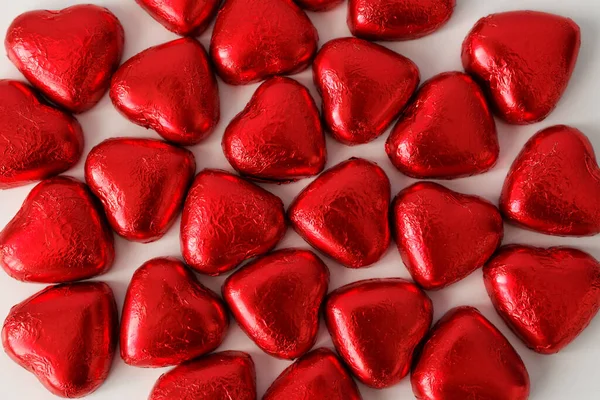 Love Valentine Day Background Close Chocolate Candies Hearts Red Foil — Stock Photo, Image