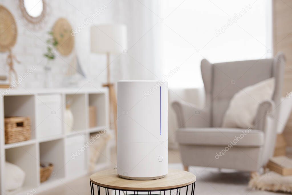 close up of white air humidifier in modern scandinavian interior