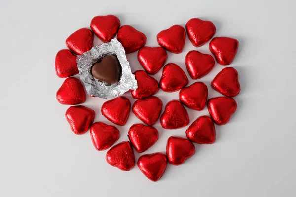 Love Broken Haert Concept Heart Shape Chocolate Candies Wrapped Red — Fotografia de Stock