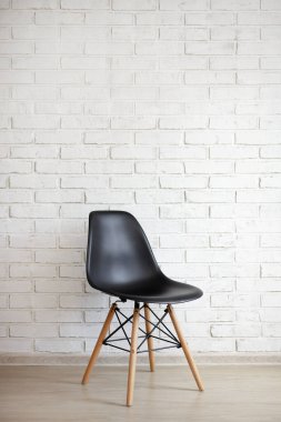 chair over white brick wall background with copy space