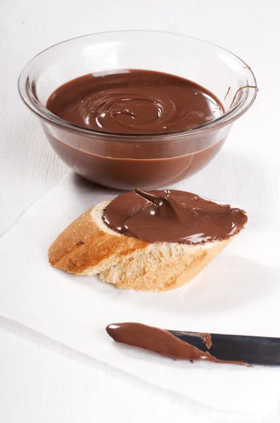 Chocolate spread on baguette — Stock Photo, Image