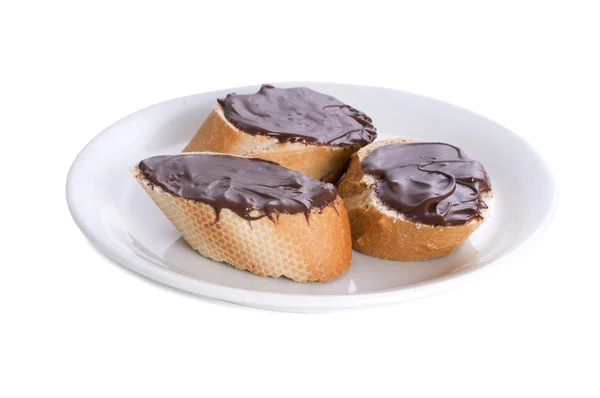 Chocolate spread on baguette — Stock Photo, Image