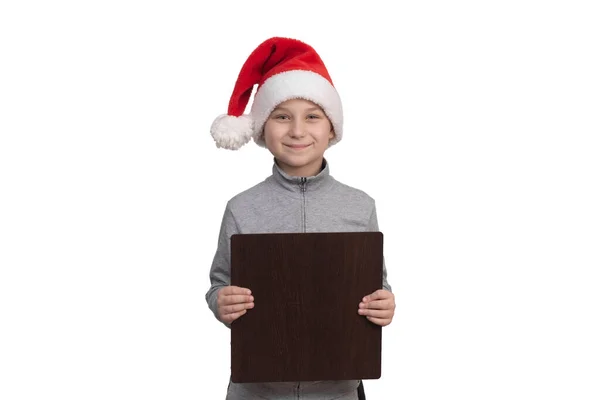 Happy boy showing blank board in hands with copy space for your text. — Stock Photo, Image