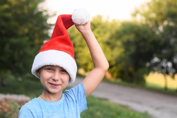 A smiling boy in Santas helper hat. — Stock Photo, Image