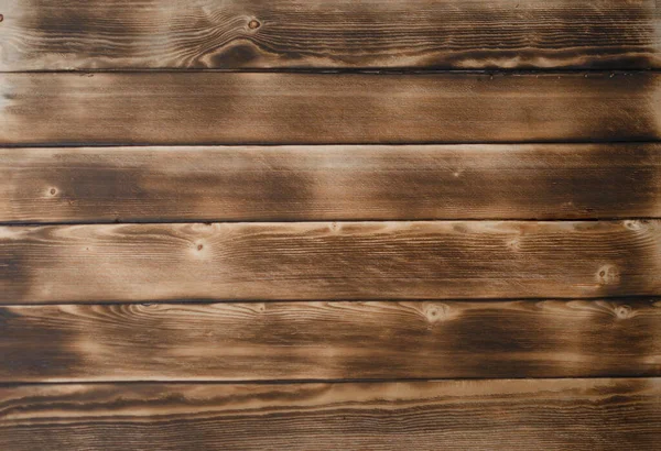 Verbrande oude Board. Textuur planken van donkerbruin oud hout. — Stockfoto