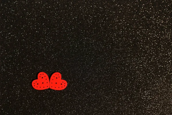 Two Hearts On a shiny black Background — Stock Photo, Image