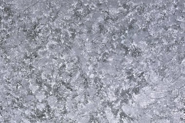 Gri soyut desenli arka plan. kabaca alçılı hacimli beton ya da alçı taşı duvarı.