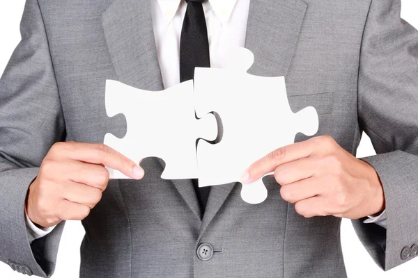 Businessman holding mismatch jigsaw — Stock Photo, Image