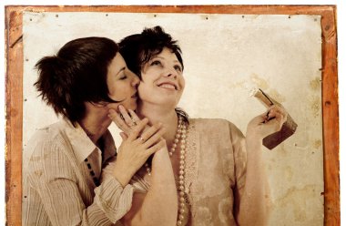 Women couple embracing old-fashioned