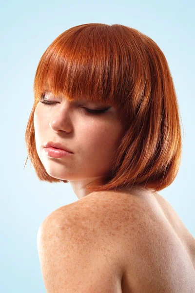 Woman beautiful young make-up isolated on blue background — Stock Photo, Image