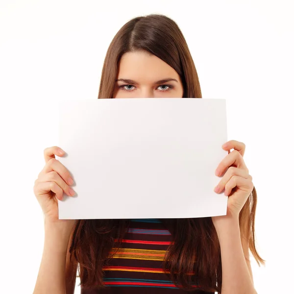 Teen girl holding blank white paper closeup isolated on white — Stock Photo, Image