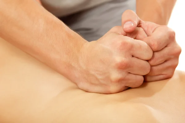 Ręce masażysty masaż młody piękny na białym tle na whi — Zdjęcie stockowe