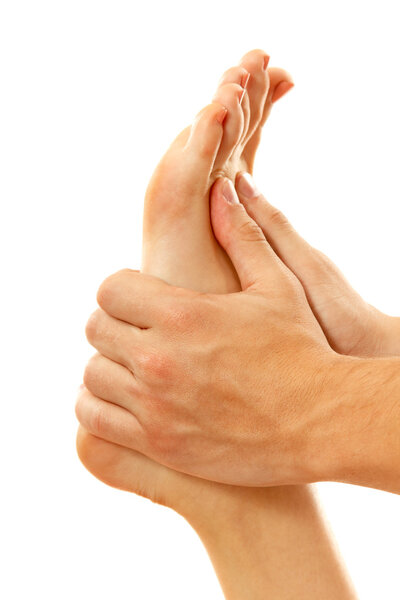 Массаж ног женский крупный план, изолированный на белом
