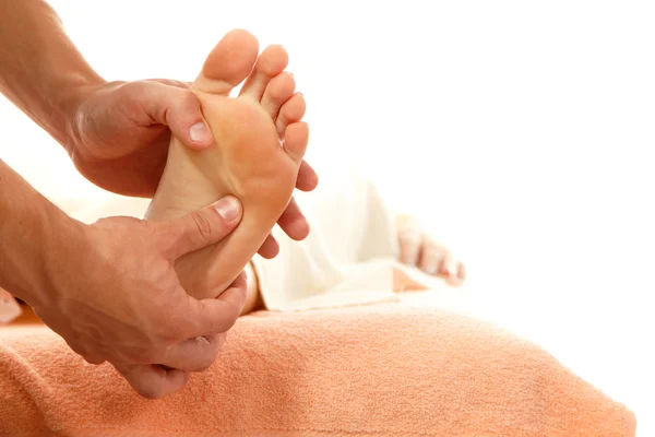 Massage foot female close-up isolated on white — Stock Photo, Image