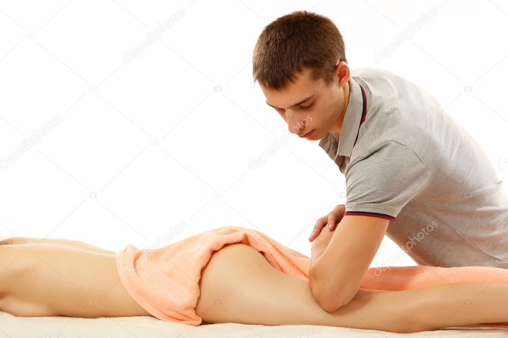 Masseur makes anticellulite massage young woman