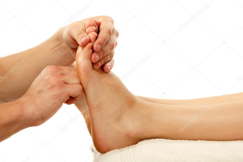 massage foot female close-up isolated on white