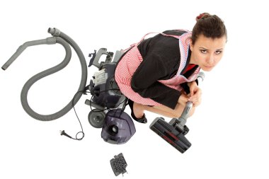 Businesswoman and housewife tired in apron with broken vacuum cleaner clipart