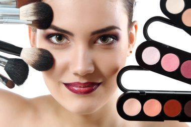 beauty portrait of young beautiful woman with makeup brushes and clipart