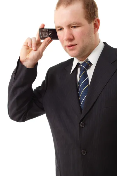 Młody biznesmen mówiąc telefon komórkowy — Zdjęcie stockowe