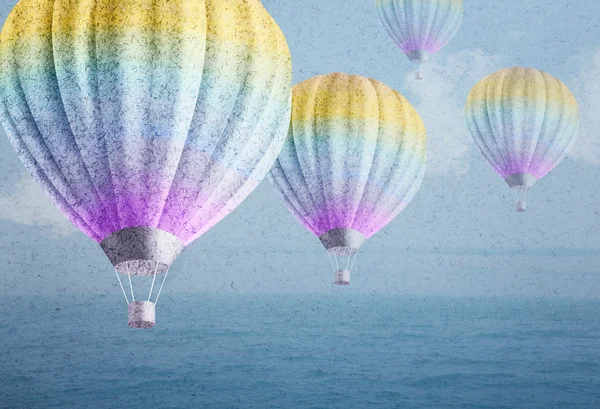 Balloons over watercolor sea landscape paper grunge background — Stock Photo, Image