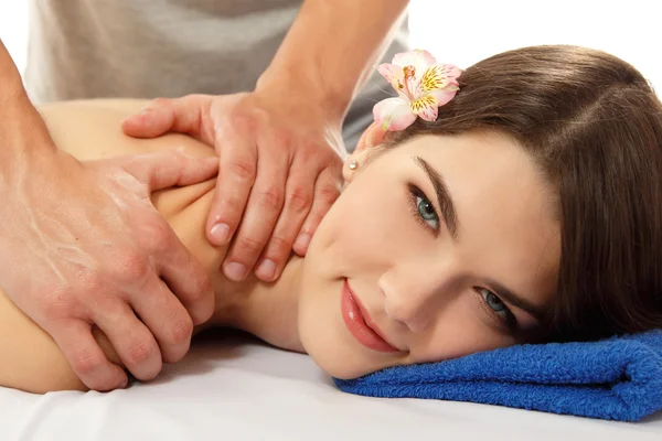 Mulher de massagem jovem bonita alegre isolado no branco — Fotografia de Stock