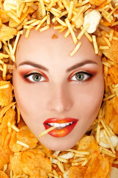 Portrait of beautiful cheerful young female face with unhealth eating fast food potato chips and rusk frame — Stock Photo, Image