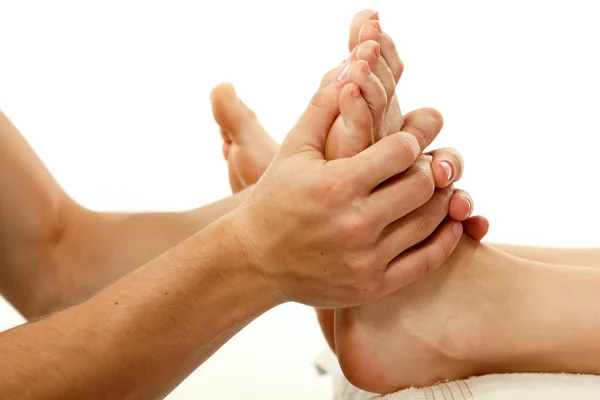 Massage Fuß weiblich close-up isoliert auf weiß — Stockfoto