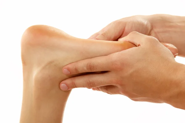 Massage foot female close-up isolated on white — Stock Photo, Image