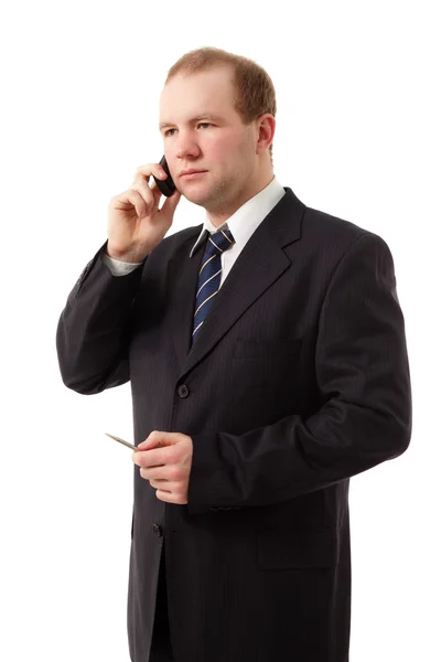 Młody biznesmen mówiąc telefon komórkowy — Zdjęcie stockowe