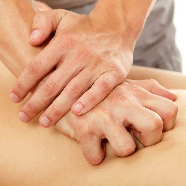 Hands of masseur massaging woman young beautiful — Stock Photo, Image