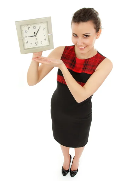 Donna d'affari allegra orologio tenuta isolato su bianco Fotografia Stock