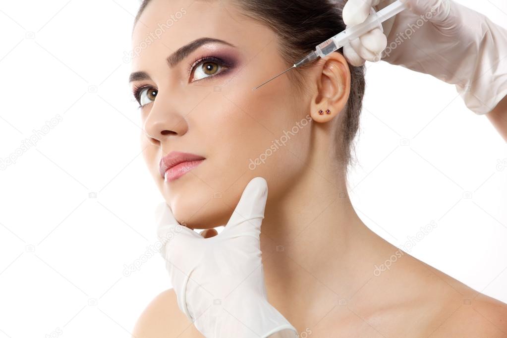 beautiful young female face with beauty treatment