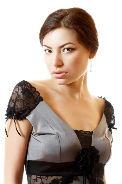Beautiful face of young woman in dress — Stock Photo, Image
