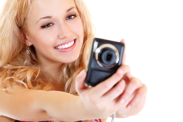 Happy young woman photographer doing photos with still camera