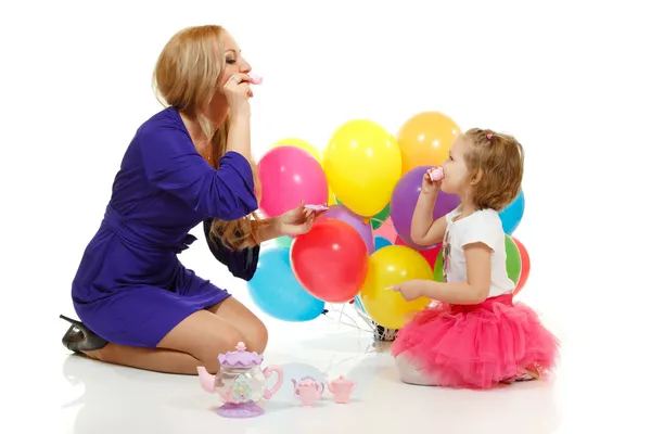 Young attractive woman with cute little girl play mother-daughter — Stock Photo, Image
