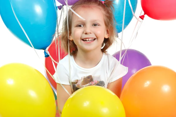 Renkli balon üzerinde beyaz izole küçük kız portresi — Stok fotoğraf