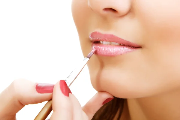 Esthetician apply lipstick on female lips closeup — Stock Photo, Image