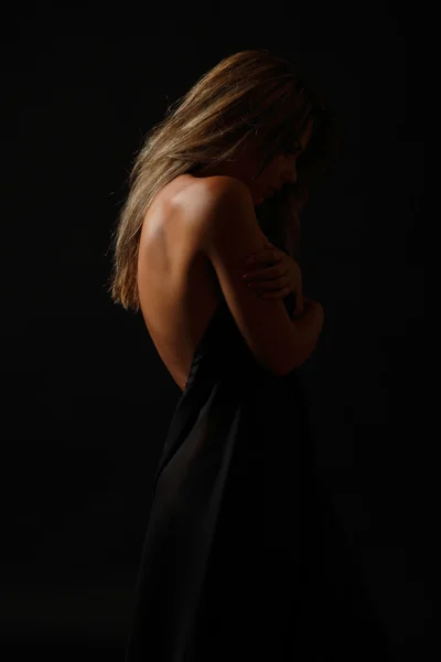 Beautiful back of sexy nude young woman with black fabric — Stock Photo, Image